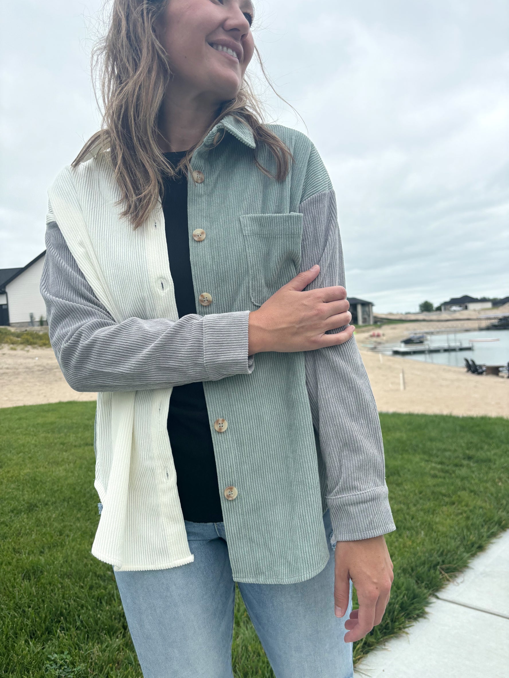 Bryant colorblock corduroy jacket in off-white, grey, and sage green with collared neckline and button-up, shown in size small