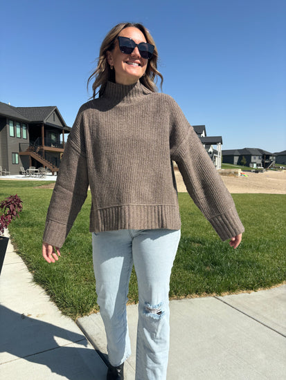 styled view of Winmere knit sweater with mock neck, split hem, oversized fit, poly/acrylic/wool/spandex blend, shown in size medium