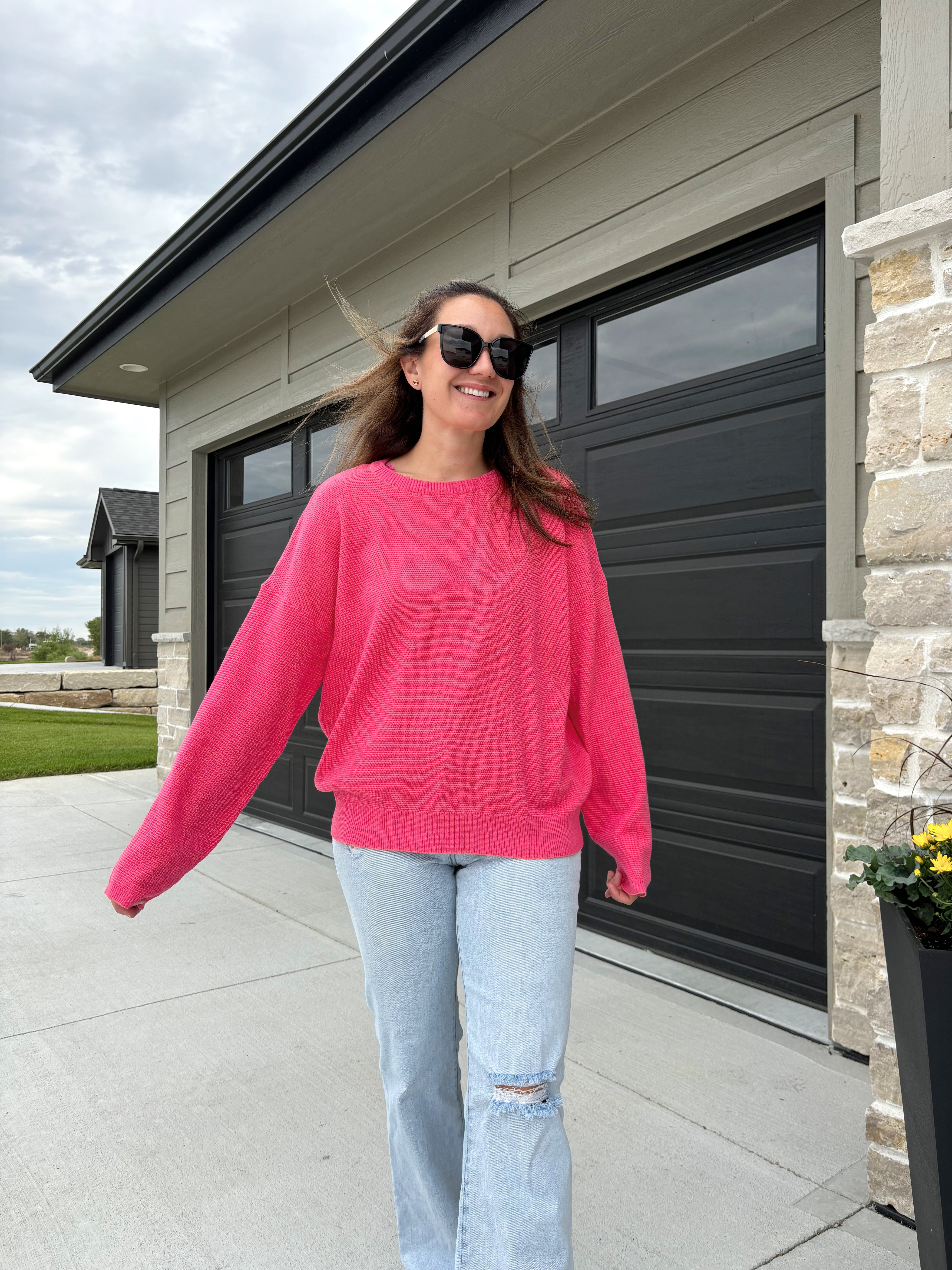 styled view of Hinston two-tone waffle knit sweater in fuchsia and coral, 100% cotton, shown in size medium