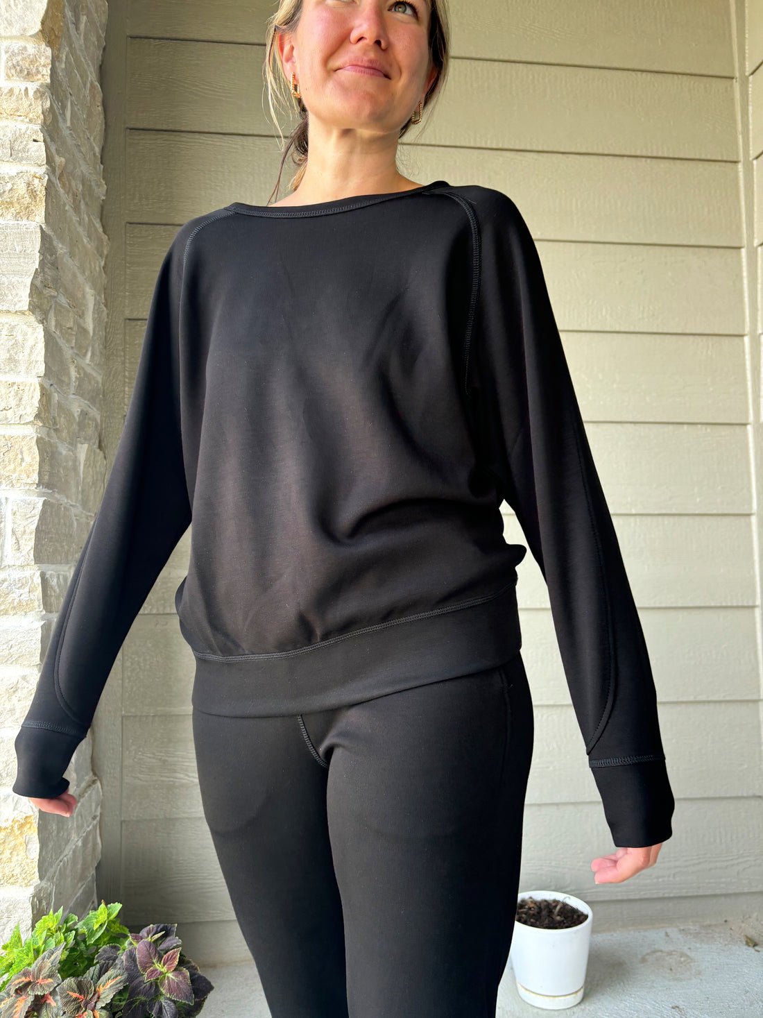 Cambridge black crew neck sweater, cozy and stylish, shown in size medium