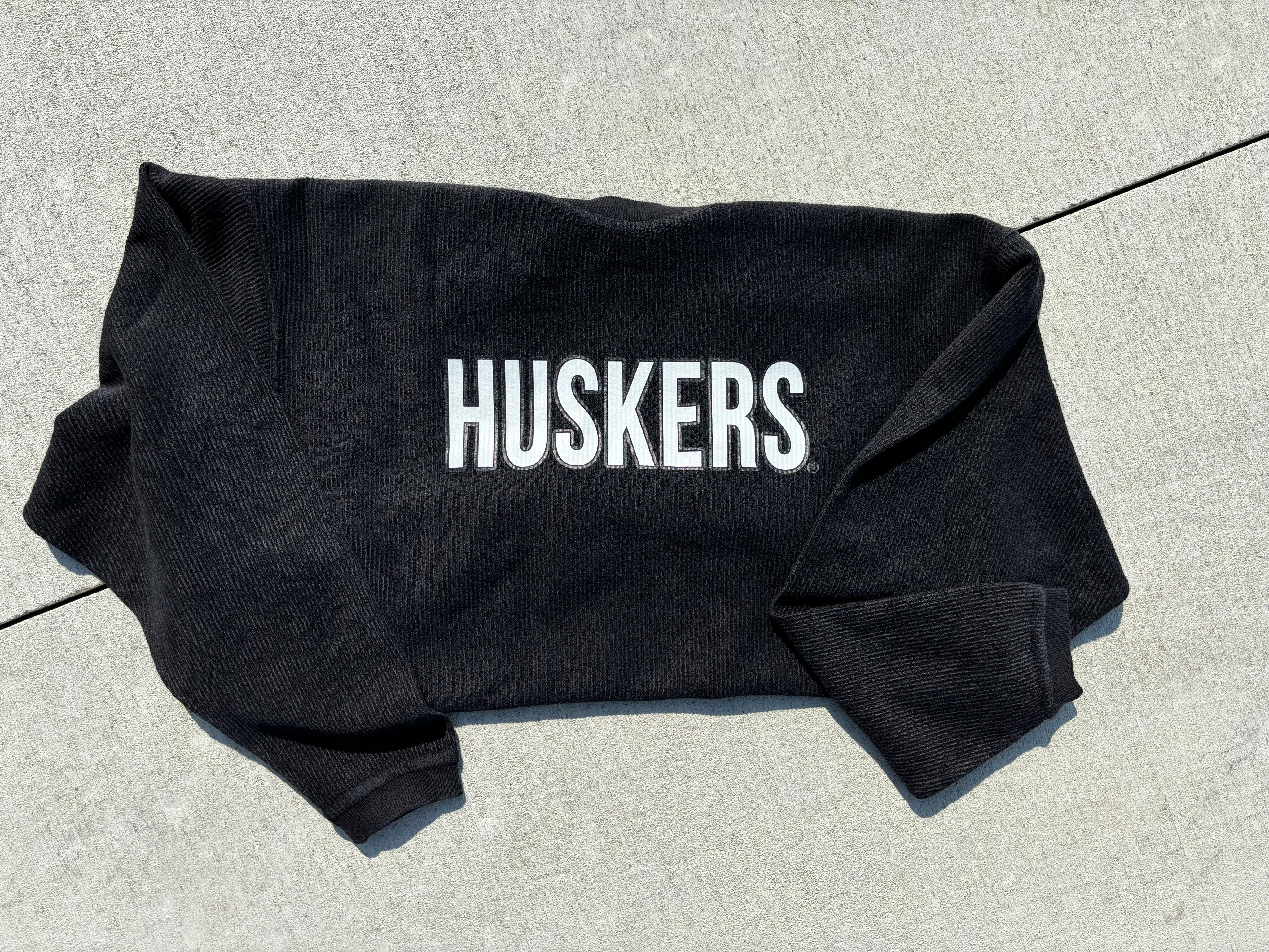 Black Huskers corded sweatshirt, officially licensed by the University of Nebraska, cozy fit, shown in size small