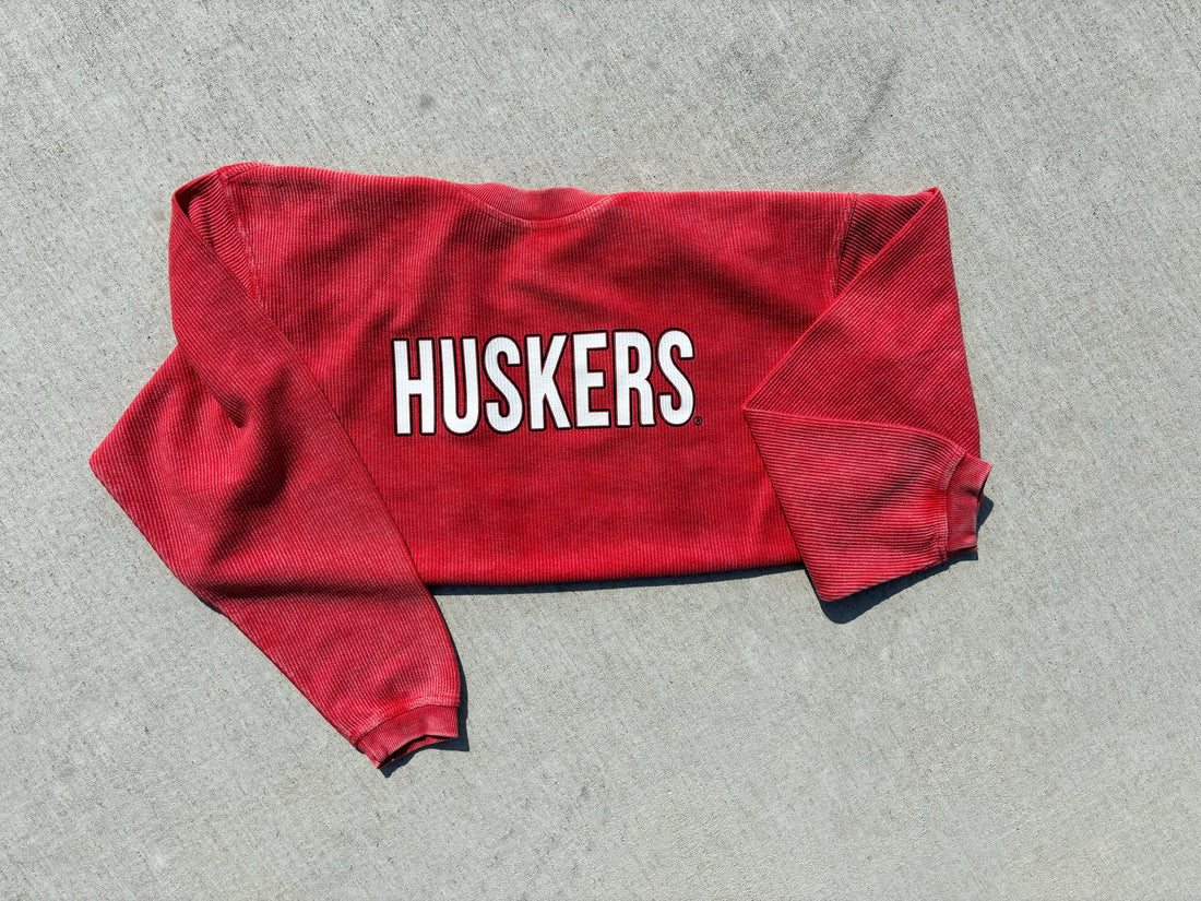 Red Huskers corded sweatshirt, officially licensed by the University of Nebraska, cozy fit, shown in size small