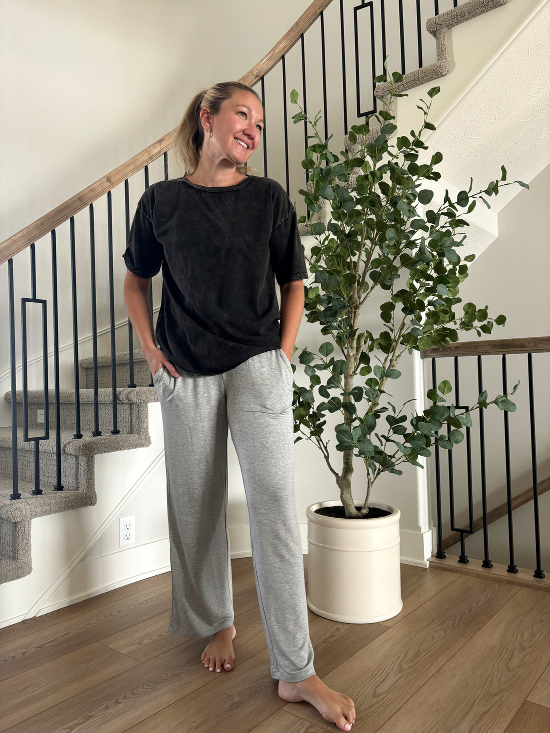 front view of Lincoln mid-rise lounge sweatpants in breathable terry material, flare bottoms, elastic waistband with drawstring, shown in size Medium