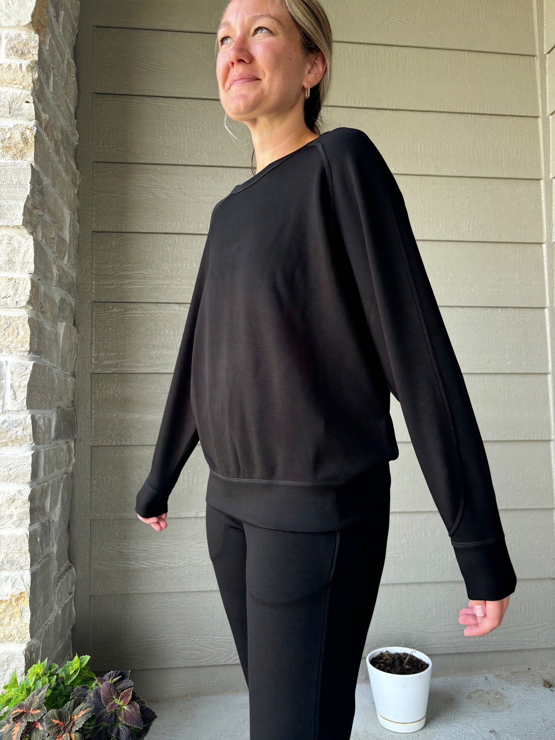 alternite view of Cambridge black crew neck sweater, cozy and stylish, shown in size medium