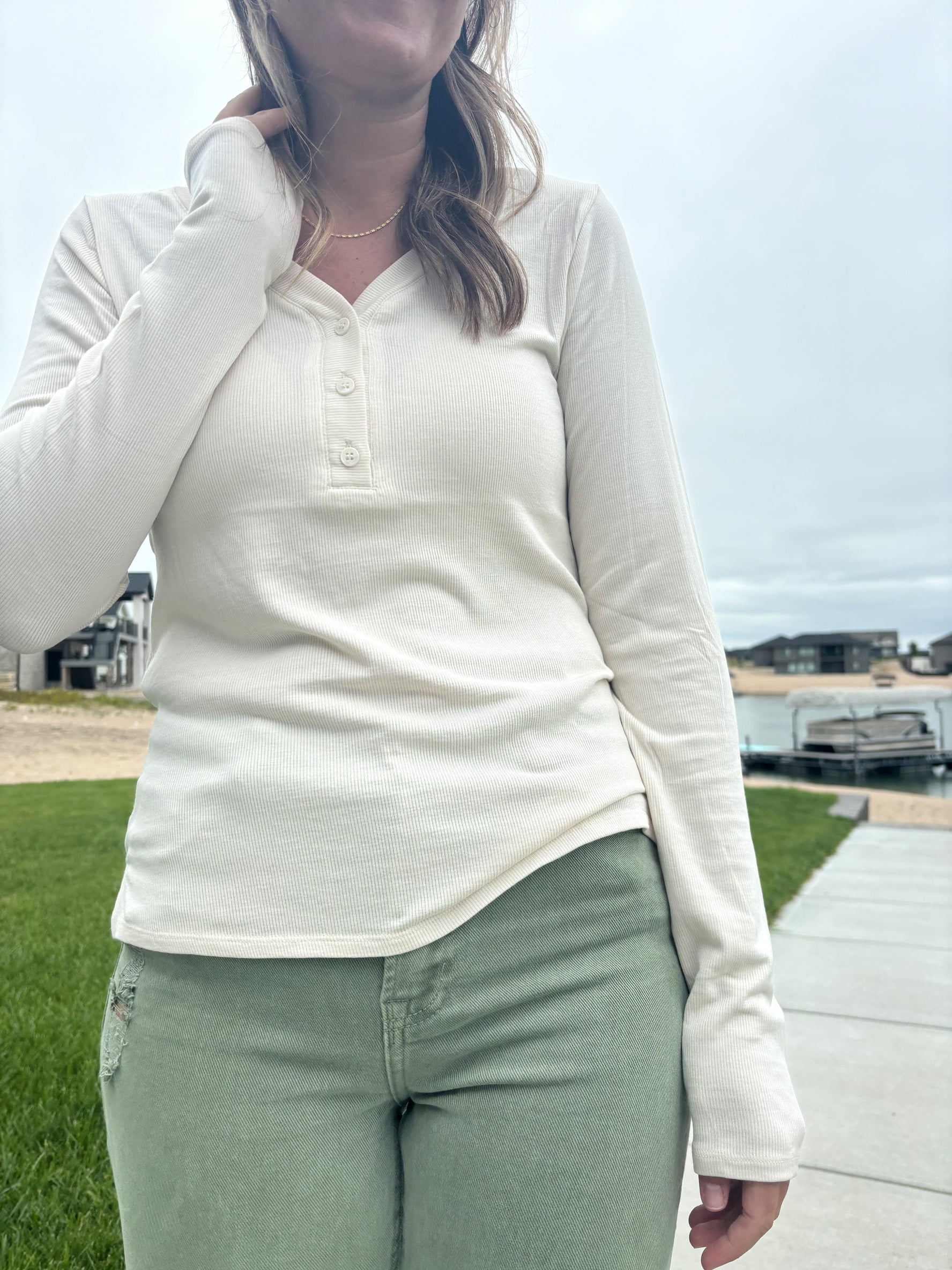 close up detail of Nichols cream Henley long sleeve top, ultra-comfortable micro-modal/spandex blend, shown in size medium