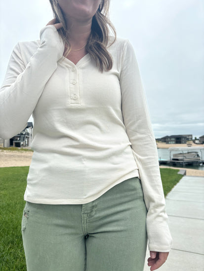 close up detail of Nichols cream Henley long sleeve top, ultra-comfortable micro-modal/spandex blend, shown in size medium