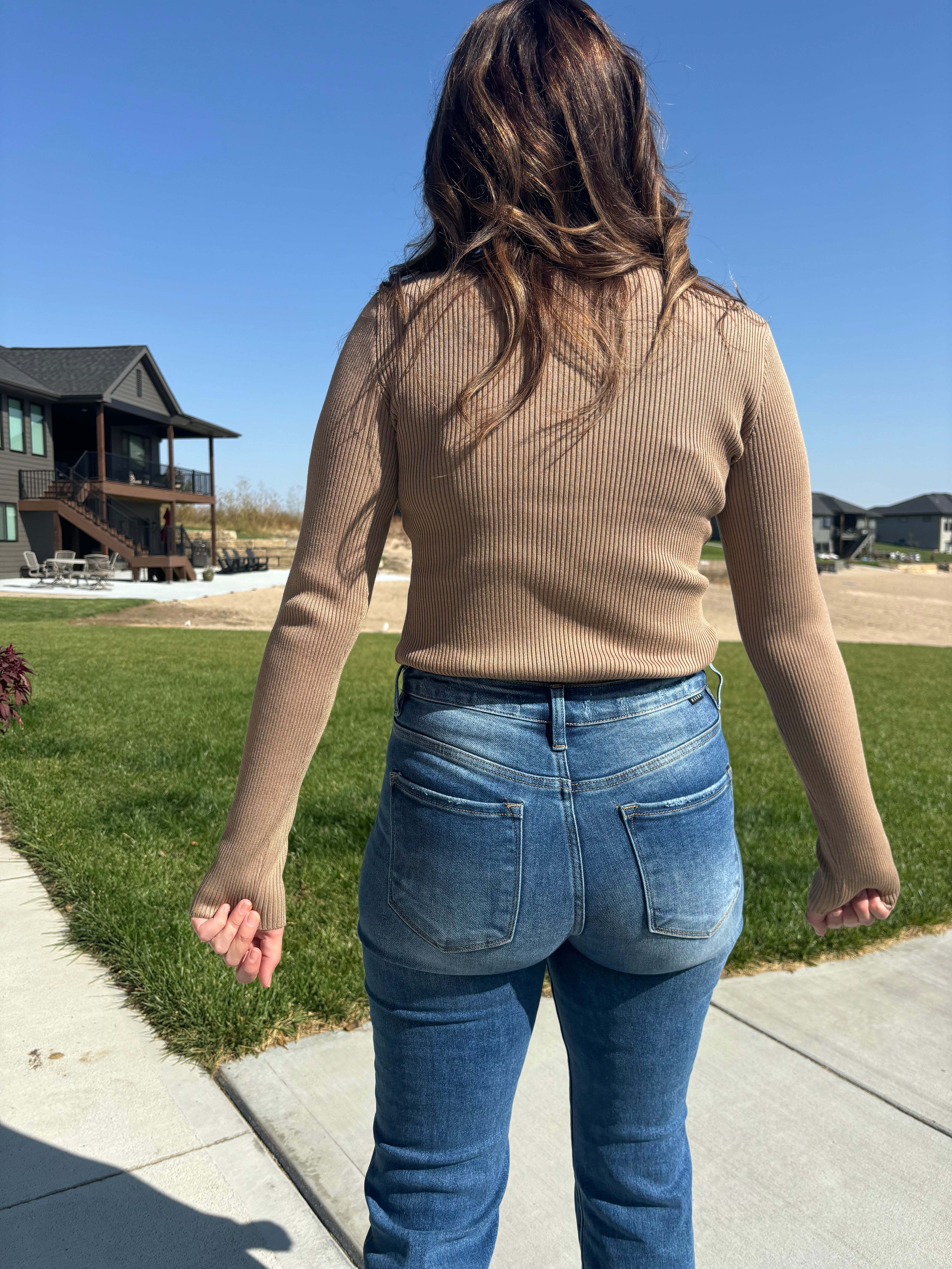 back view of Tan Raymond long sleeve top with round neck and ribbed pattern, shown in size large