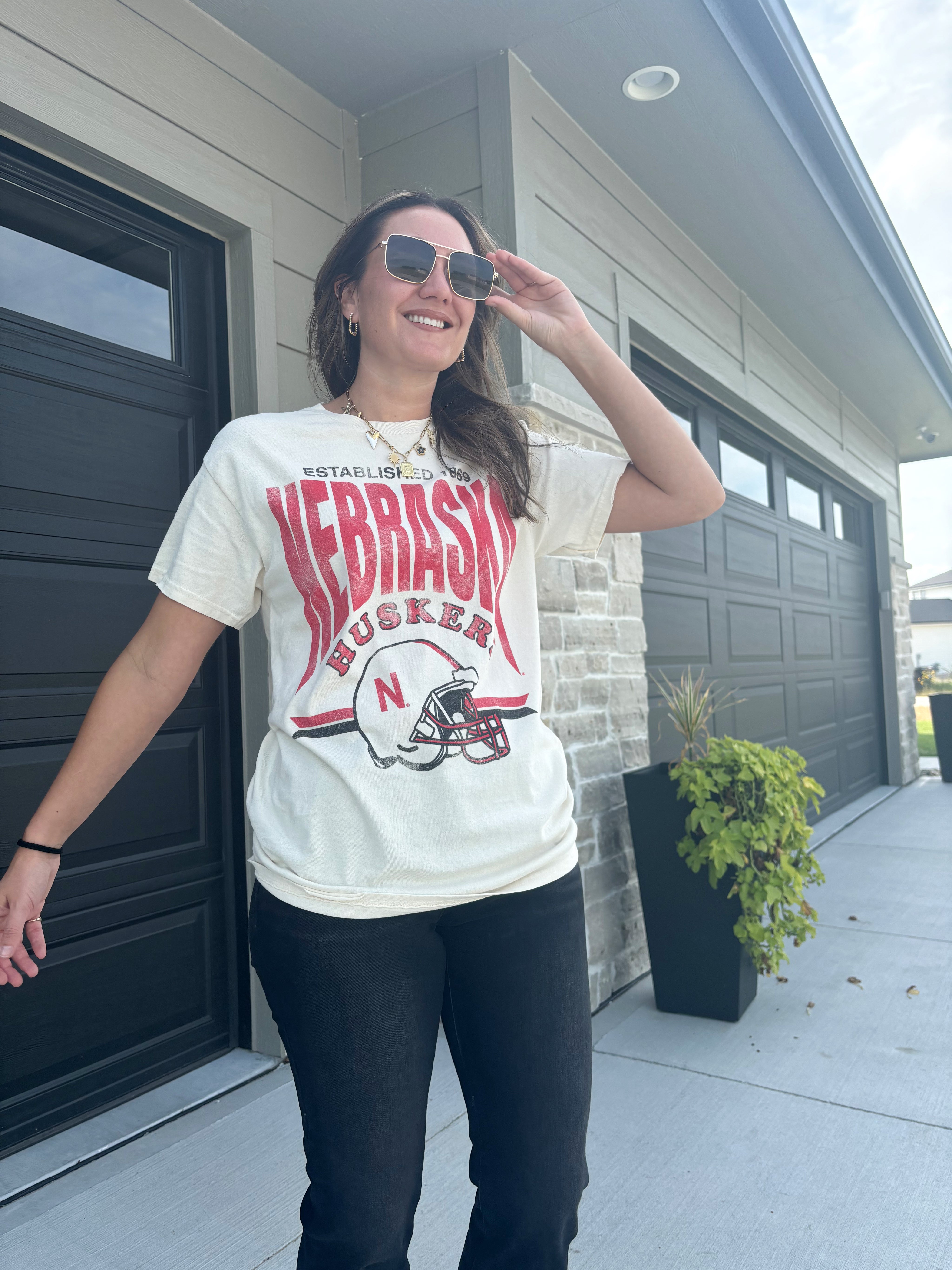 Nebraska Huskers distressed helmet tee, oversized fit, pre-shrunk 100% cotton, officially licensed, shown in size small