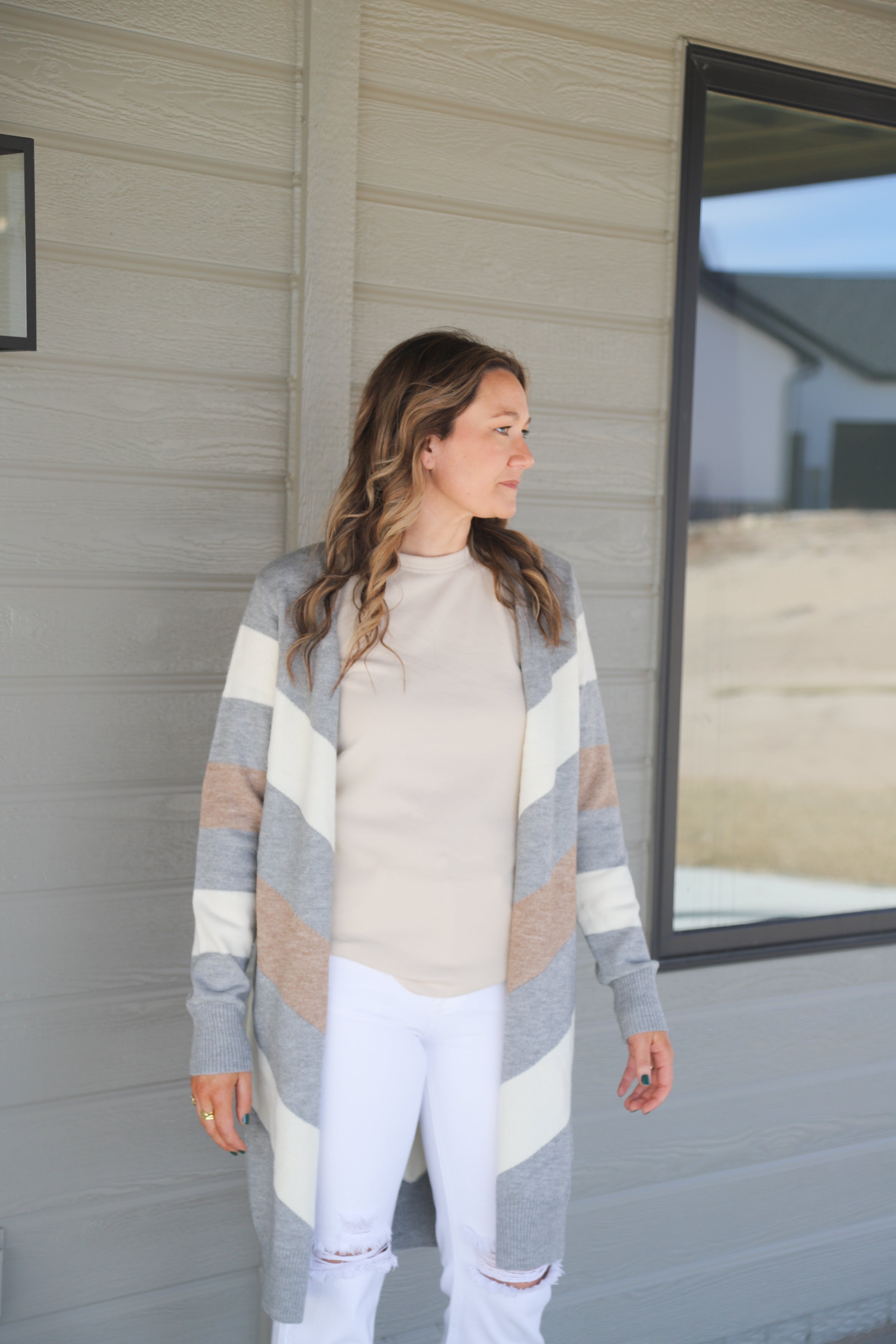 styled view of Parmenter chevron sweater cardigan in heather grey and cream, neutral palette, shown in size small